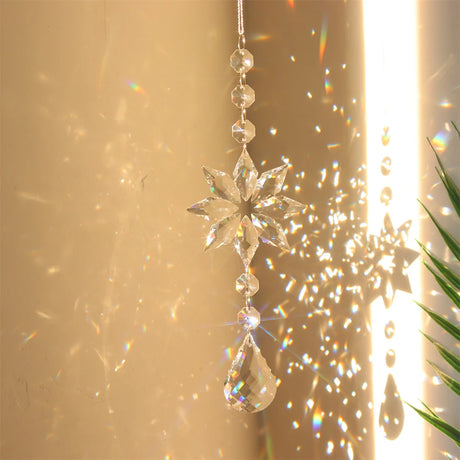 Crystal snowflake ornament with sunlight and plant shadows on a beige background