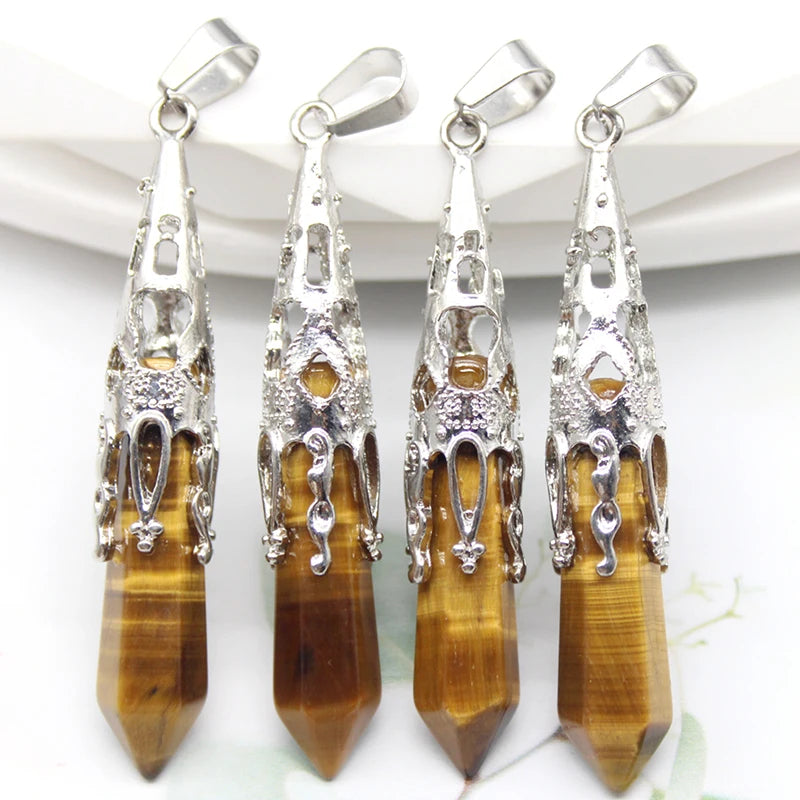 Four silver and tiger eye stone pendants on a white background