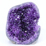 Purple crystal rock on a white background