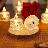 Decorative LED candles on a wooden base with a blurred background