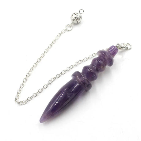 Purple crystal pendant on a silver chain against a white background