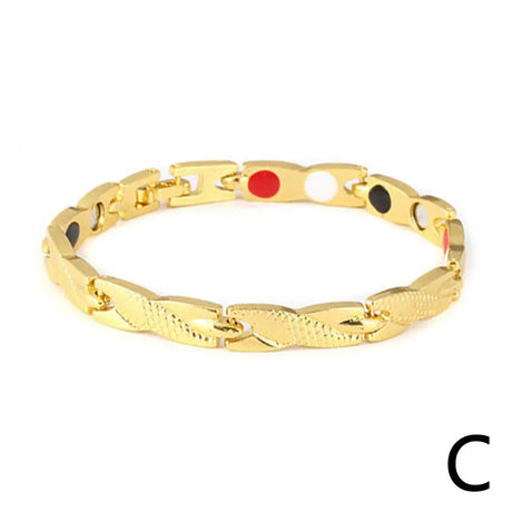 Gold bracelet with colored stones on a white background
