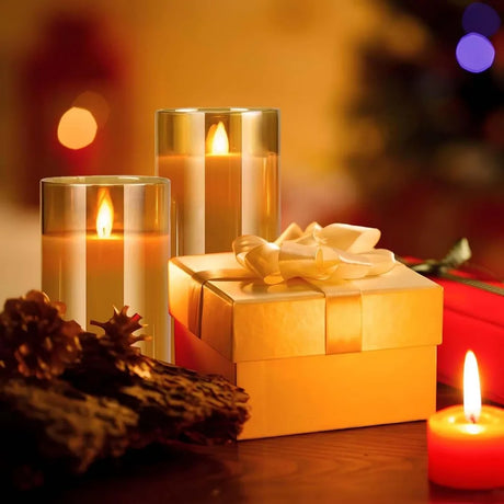 Candlelit scene with a gift box and decorative elements on a blurred background