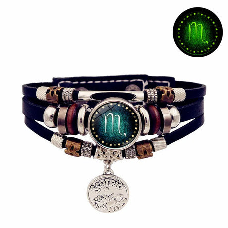 Glowing Scorpio symbol bracelet with dark background