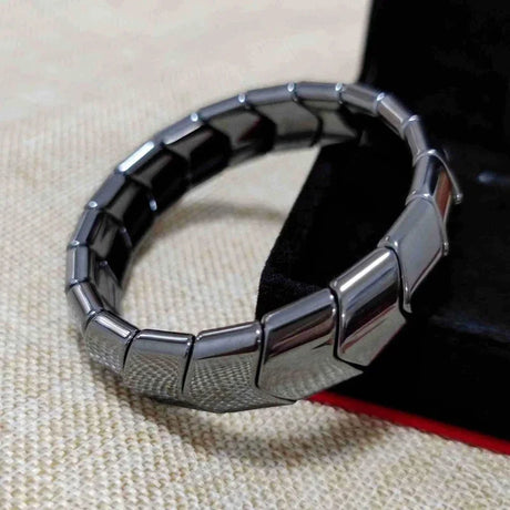 Black and silver bracelet on a textured surface