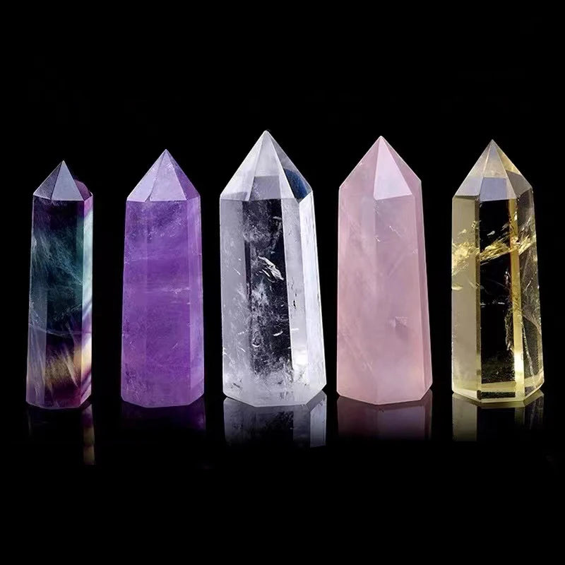 Set of five crystal towers in different colors on a black background