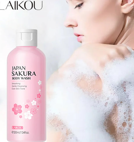 Pink bottle of LAIKOU Sakura Body Wash with a person in bubbles on a light background