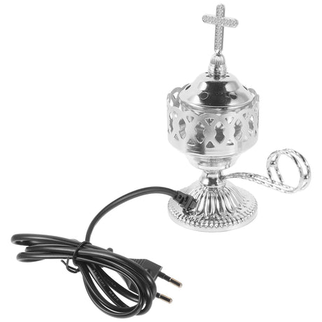 Decorative silver lamp with cross on top and black cord on a white background