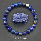 Lapis Lazuli bracelet with a piece of raw lapis lazuli stone on a dark background