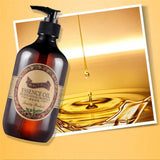 Bottle of essence oil with a label on a yellow background