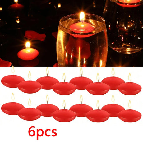 Red floating candles with a glass of wine in the background