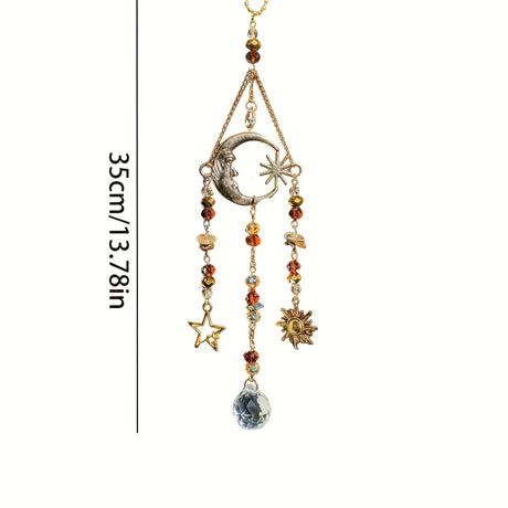 Decorative hanging ornament with celestial elements on a white background
