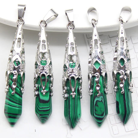 Five green stone pendants with silver settings on a white background
