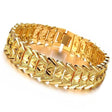 Gold bracelet with intricate design on a white background