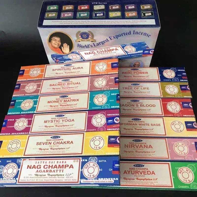 Collection of Nag Champa incense boxes with various scents on a dark background