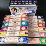 Collection of Nag Champa incense boxes with various scents on a dark background
