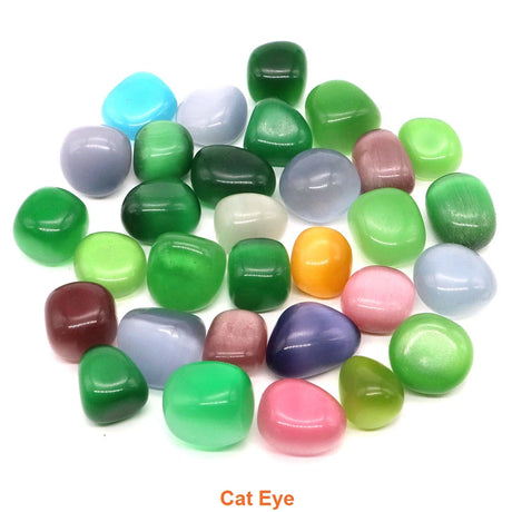 Assorted colored cat eye stones on a white background