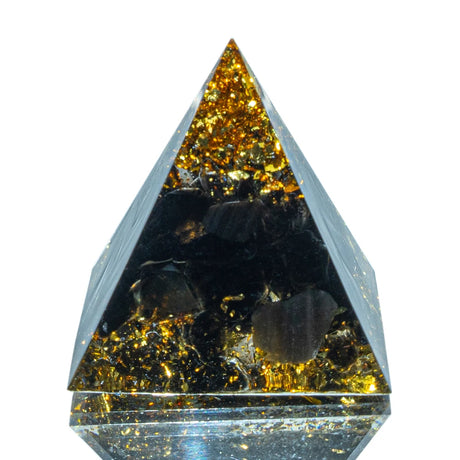 Triangular crystal with reflective surface on a white background