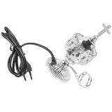 Decorative lamp with intricate design and black cord on a white background