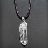 Crystal pendant necklace on a dark background