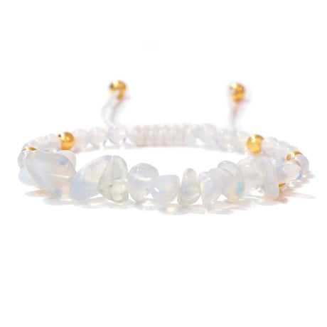 Opalite bracelet with gold accents on a white background