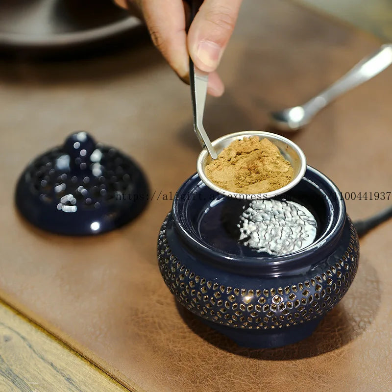 Navy blue decorative container with spices on a wooden surface