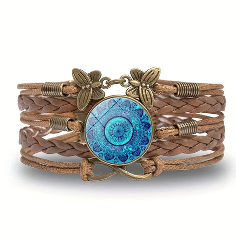 Brown braided leather bracelet with blue circular design and bronze accents on a white background