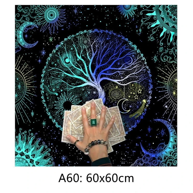 Decorative mat with tree of life design, hand holding cards, and celestial elements.
