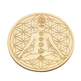 Decorative plate with a gold silhouette of a person meditating and floral geometric design on a white background