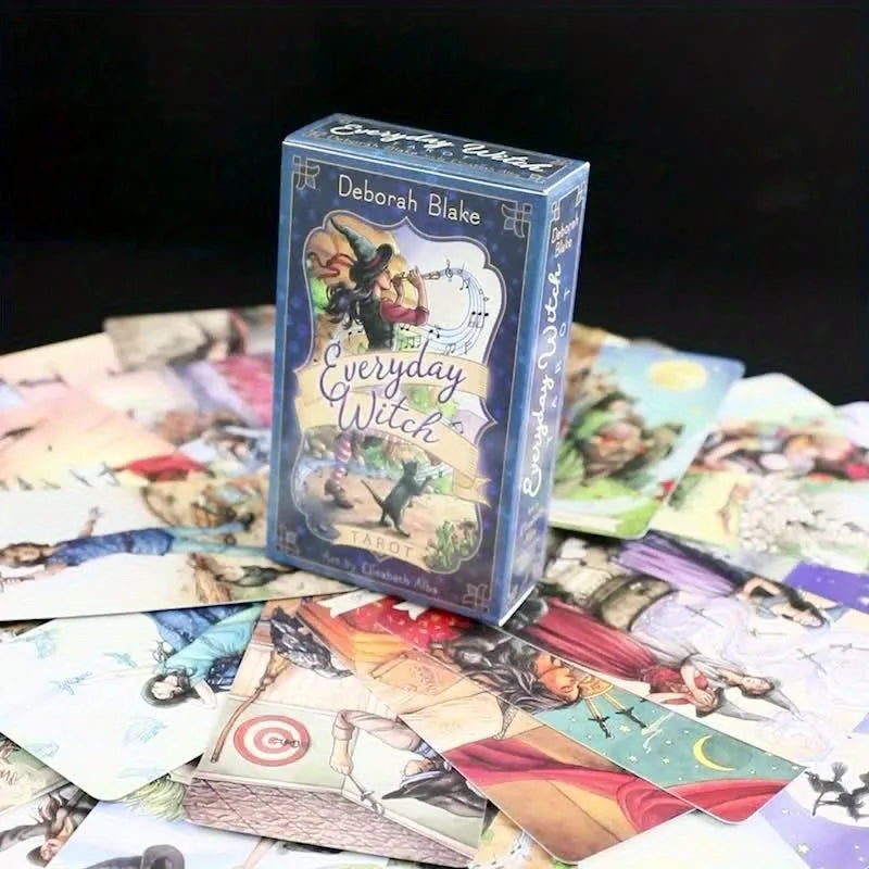 Card game box titled 'Everyday Witch' by Deborah Blake surrounded by colorful cards on a dark background