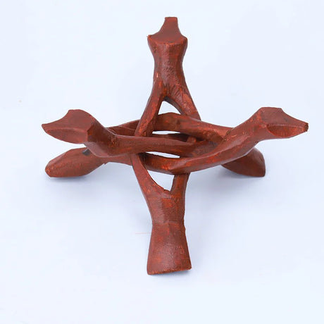Red clay sculpture on a white background