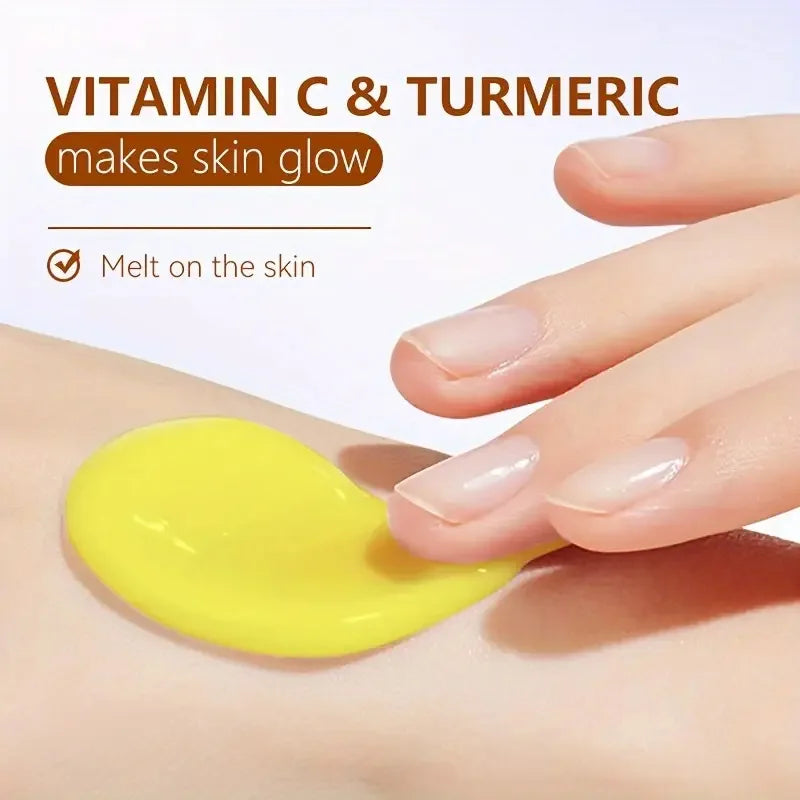Yellow cream being applied to skin with text about vitamin C and turmeric benefits