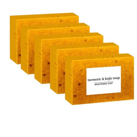 Five bars of turmeric and kojic soap on a white background