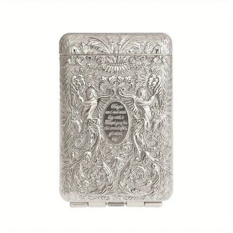 Silver cigarette case with intricate engravings on a white background