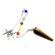 Crystal pendulum with rainbow beads and a tiger eye crystal on a white background