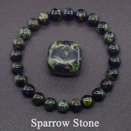 Beaded bracelet with a central stone on a gray background, labeled 'Sparrow Stone'.