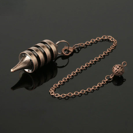 Bronze-colored metal cone with chain on a black background