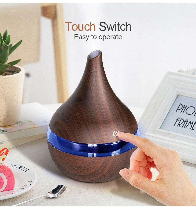Wooden-textured diffuser with touch switch on a table