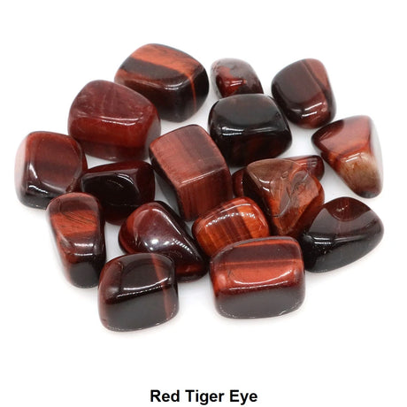 Red tiger eye stones on a white background