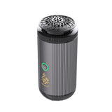 Gray cylindrical device with textured top and visible branding on a white background