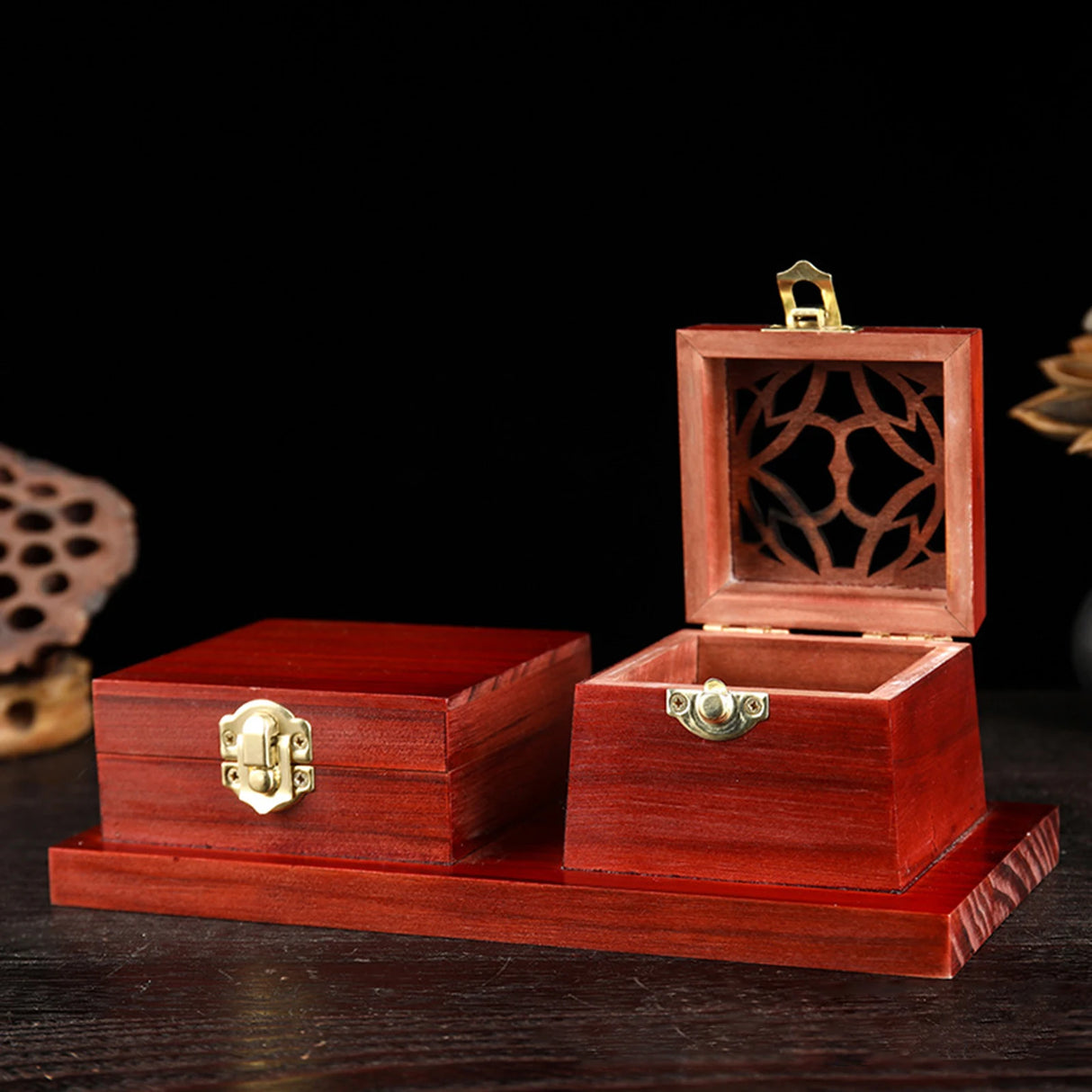 Wooden jewelry box with intricate design on a dark background