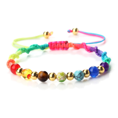Colorful beaded bracelet with various beads on a white background