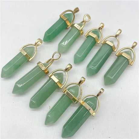 Green crystal pendants with gold accents on a white background