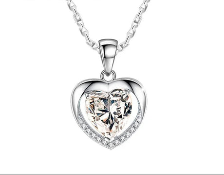 Heart-shaped silver pendant with clear gemstone on a white background, featuring the brand 'Giemi'.