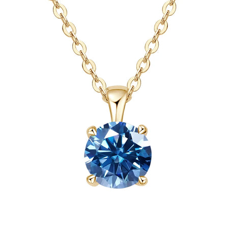 Gold necklace with a blue gemstone pendant on a white background
