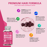 Biotin gummies supplement with vitamins and minerals for hair health on a pink background