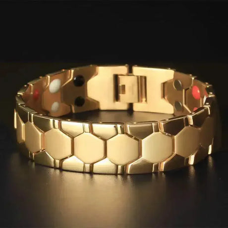 Gold bracelet with honeycomb pattern on a dark background