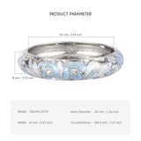 Silver ring with blue floral design and measurements on a white background