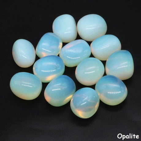 Collection of opalite stones on a black background
