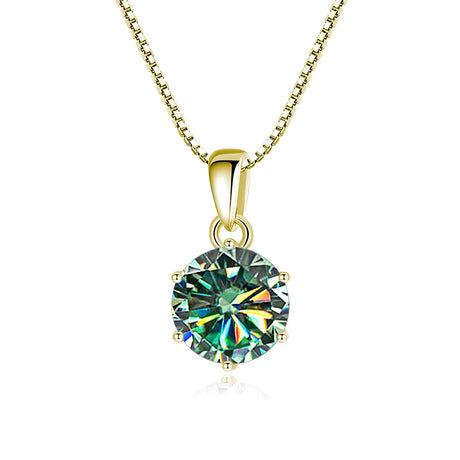 Gold necklace with a round green gemstone pendant on a white background